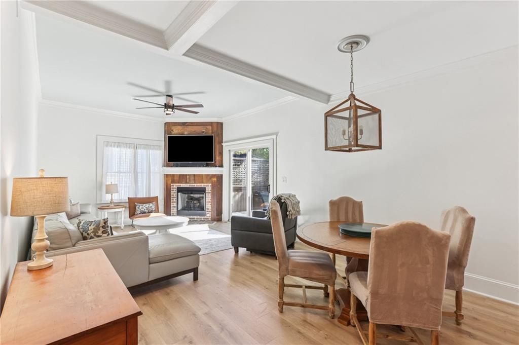 29 Sessions Street Northwest Marietta, GA 30060 - Photo 10 of 39 a living room with furniture a fireplace and a flat screen tv