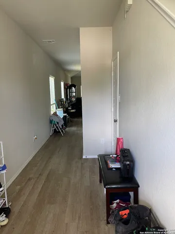 a room with furniture and a wooden floor