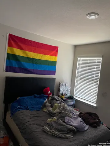 a room with a bed and a window