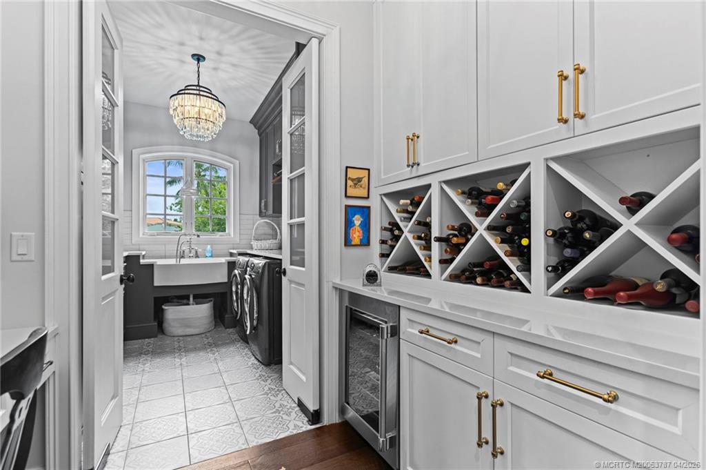 3 Island Road Sewall's Point, FL 34996 - Photo 21 of 59 Wine fridge and storage in the front.
Laundry room in the back.