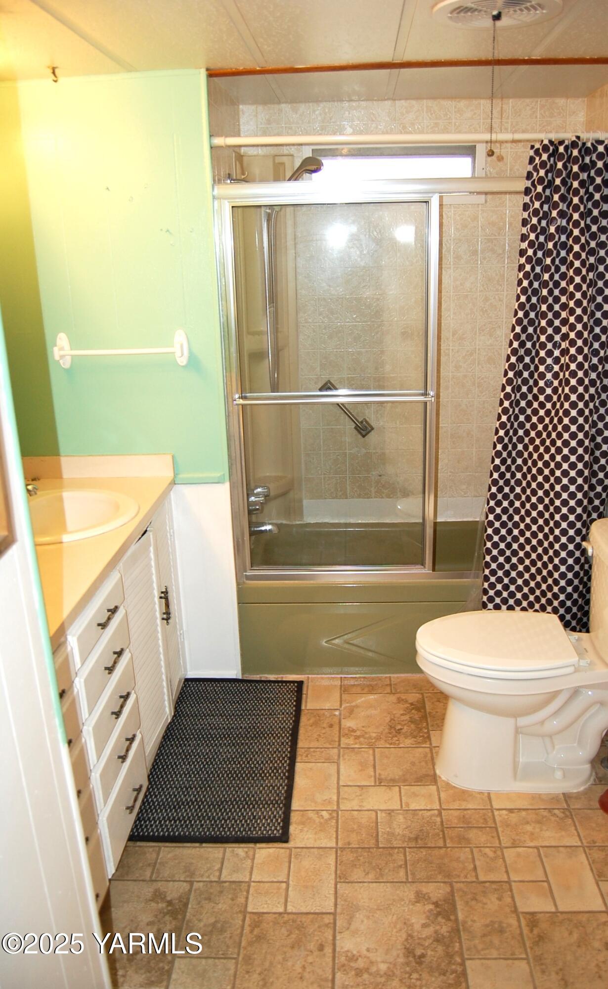 2205 Butterfield Road, Unit 14 Yakima, WA 98901 - Photo 12 of 13 a bathroom with a toilet and a shower