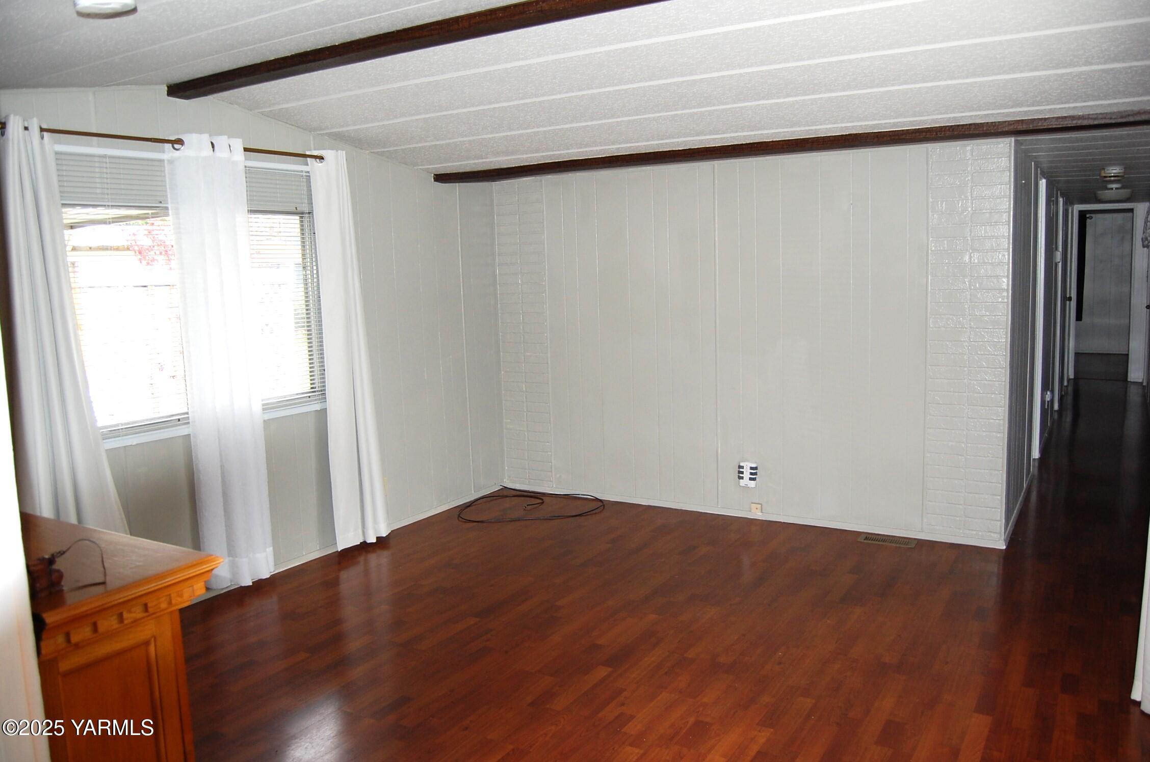 2205 Butterfield Road, Unit 14 Yakima, WA 98901 - Photo 5 of 13 a view of empty room with wooden floor and fan