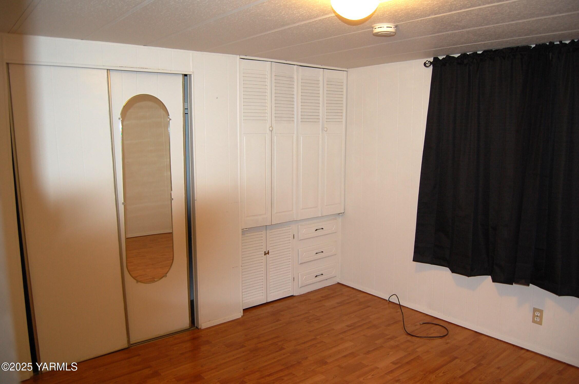2205 Butterfield Road, Unit 14 Yakima, WA 98901 - Photo 9 of 13 a view of empty room with wooden floor