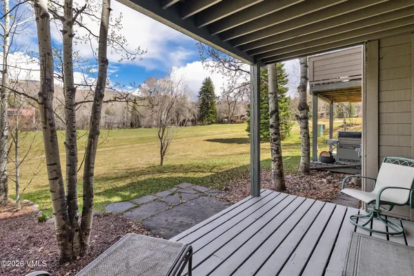 a view of a backyard with sitting area
