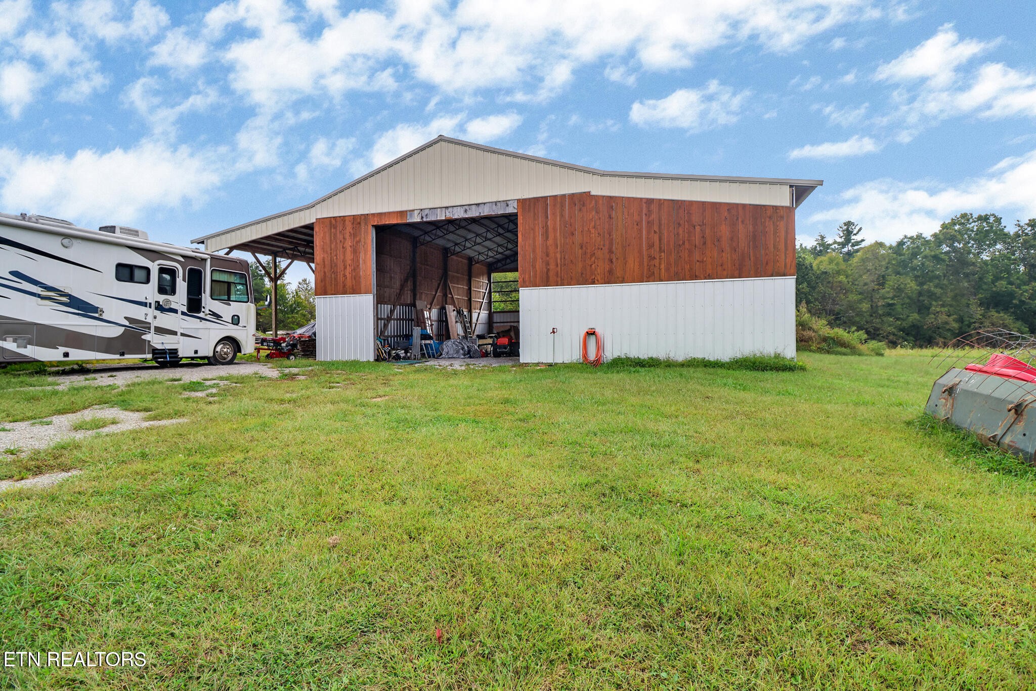 4676 Rugby Pike Allardt, TN 38504 - Photo 14 of 50 a view of a house with backyard and sitting area