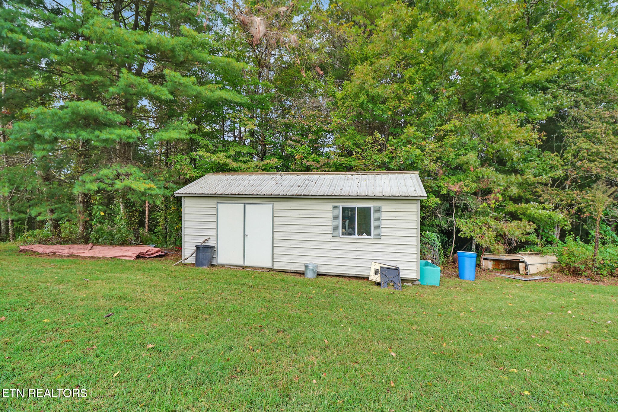 4676 Rugby Pike Allardt, TN 38504 - Photo 20 of 50 a view of a backyard with a small cabin