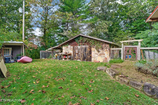 a view of a park with large trees