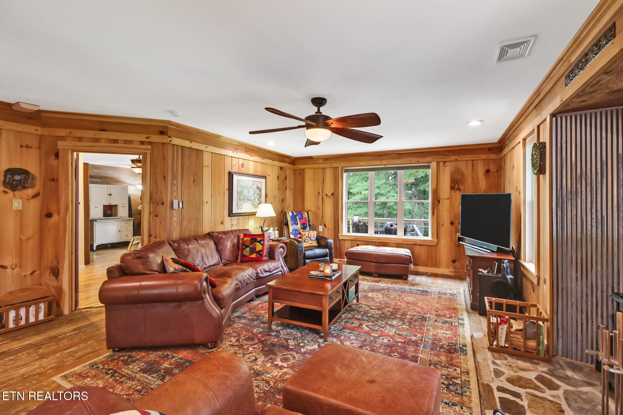 4676 Rugby Pike Allardt, TN 38504 - Photo 32 of 50 a living room with furniture flat screen tv and a large window