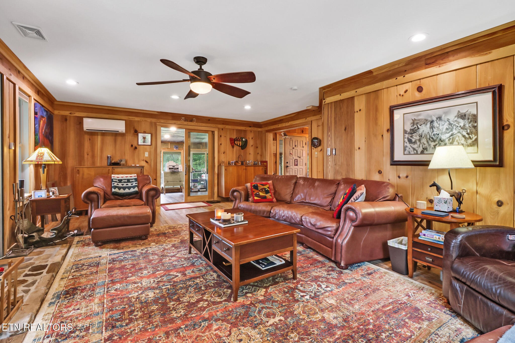 4676 Rugby Pike Allardt, TN 38504 - Photo 33 of 50 a living room with furniture a ceiling fan and a rug
