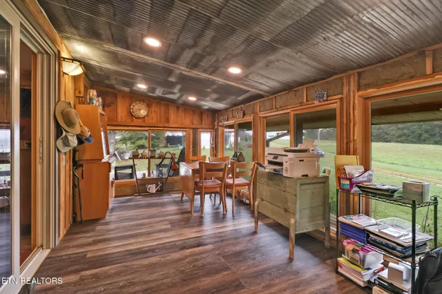 a open kitchen with stainless steel appliances granite countertop a refrigerator and a sink