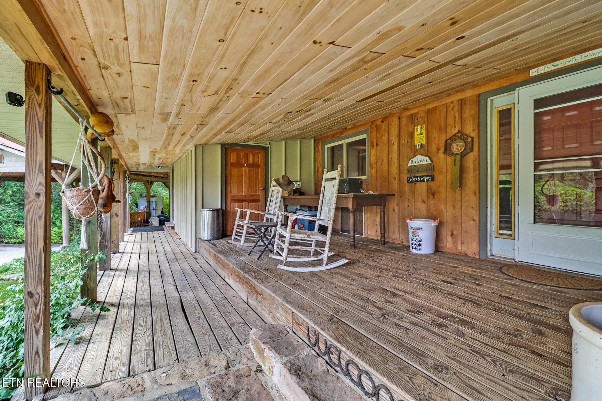 4676 Rugby Pike Allardt, TN 38504 - Photo 4 of 50 a view of a patio with table and chairs and wooden floor