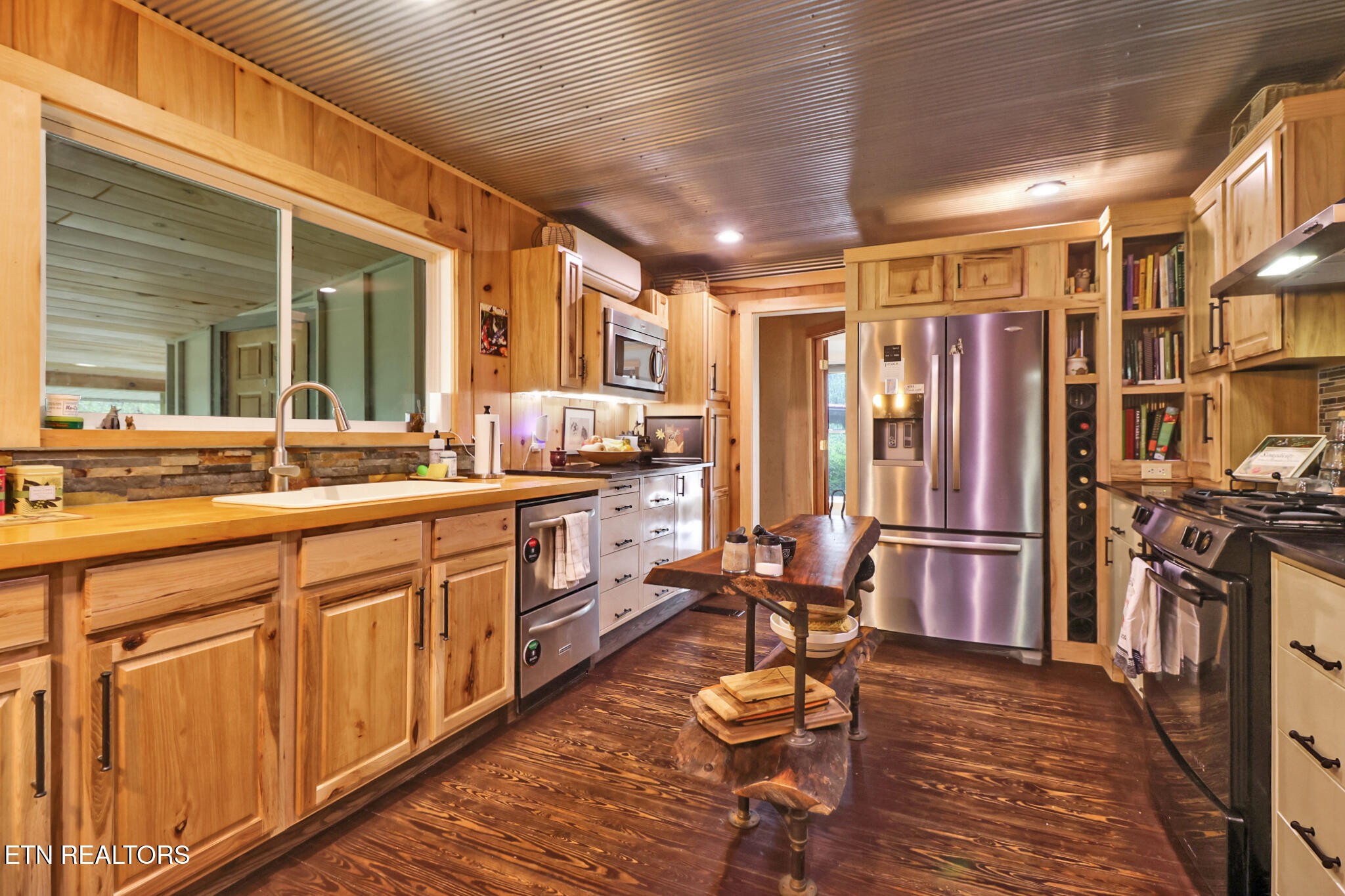 4676 Rugby Pike Allardt, TN 38504 - Photo 42 of 50 a open kitchen with stainless steel appliances granite countertop a refrigerator and a sink