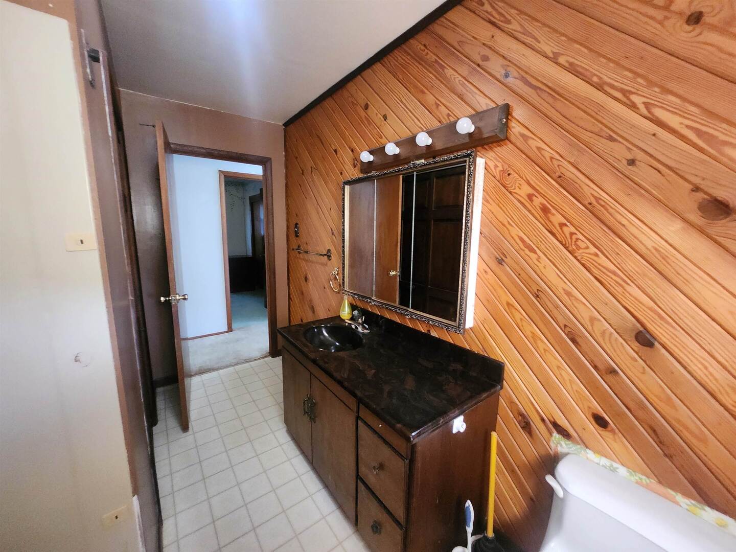 458 West Maple Street Nashville, IL 62263 - Photo 18 of 27 a bathroom with a sink and a mirror