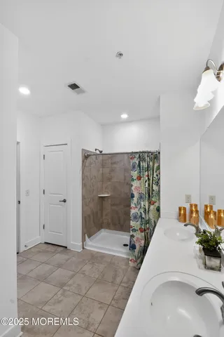 a bathroom with a sink and mirror