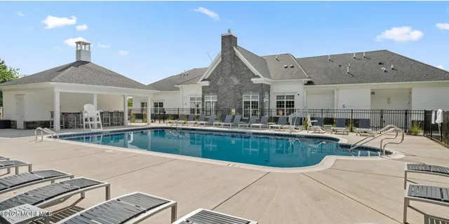 a view of a patio with couches chairs and potted plants