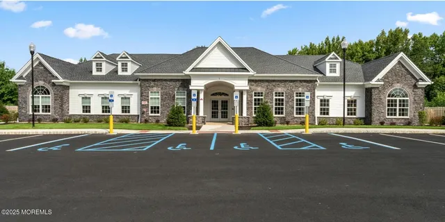 front view of a building with a garden