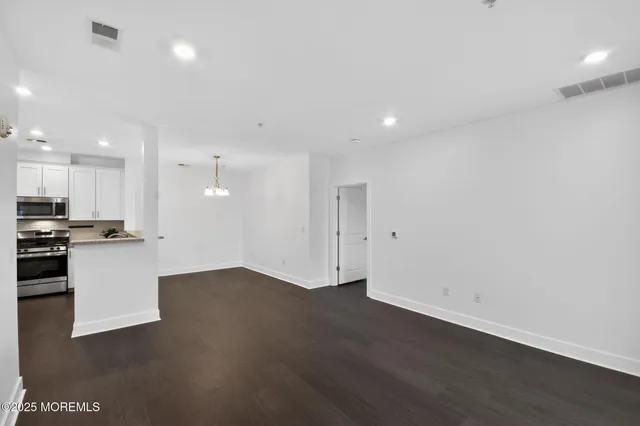 a view of kitchen with wooden floor