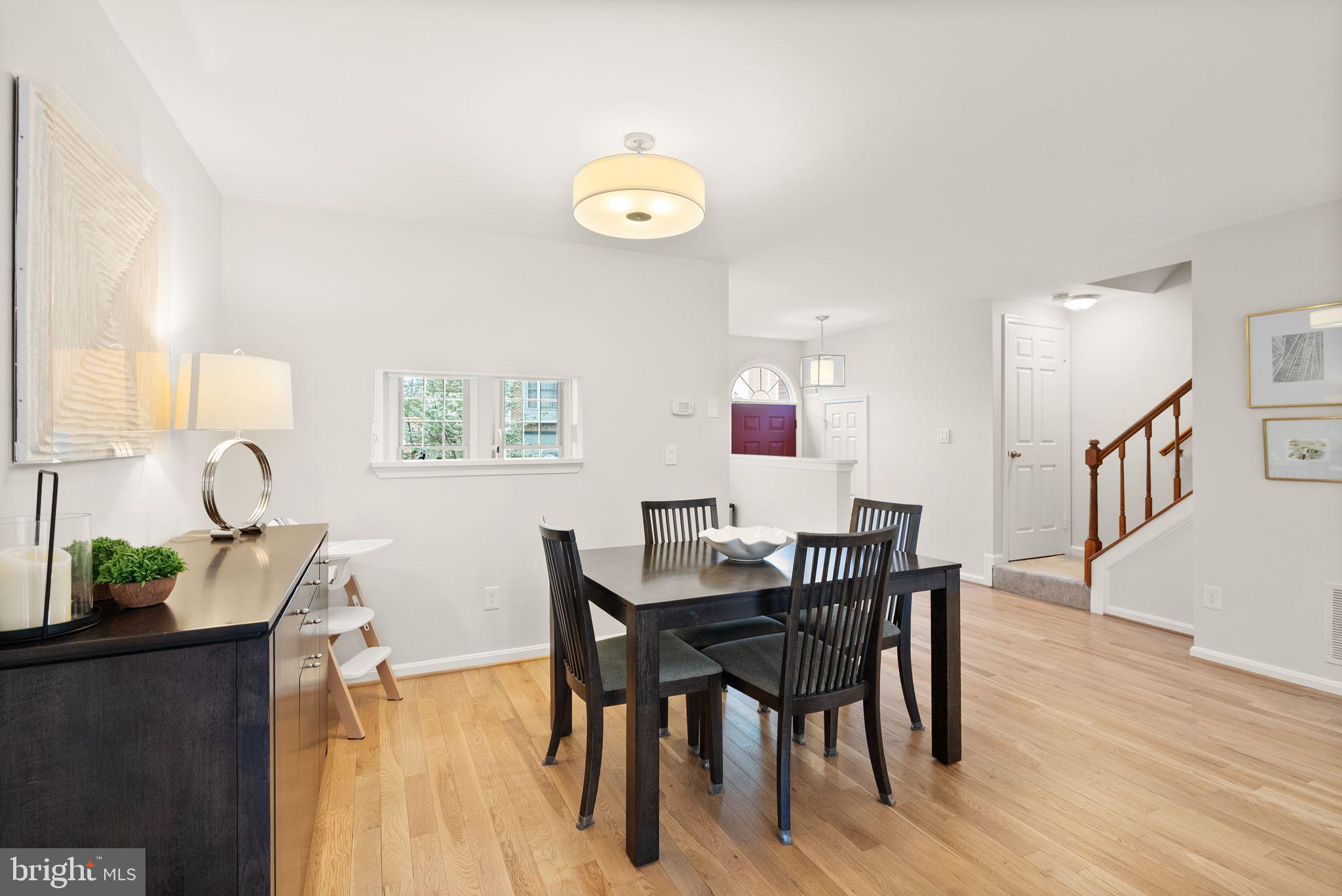 6369 English Ivy Way Springfield, VA 22152 - Photo 13 of 62 a view of a dining room with furniture and wooden floor