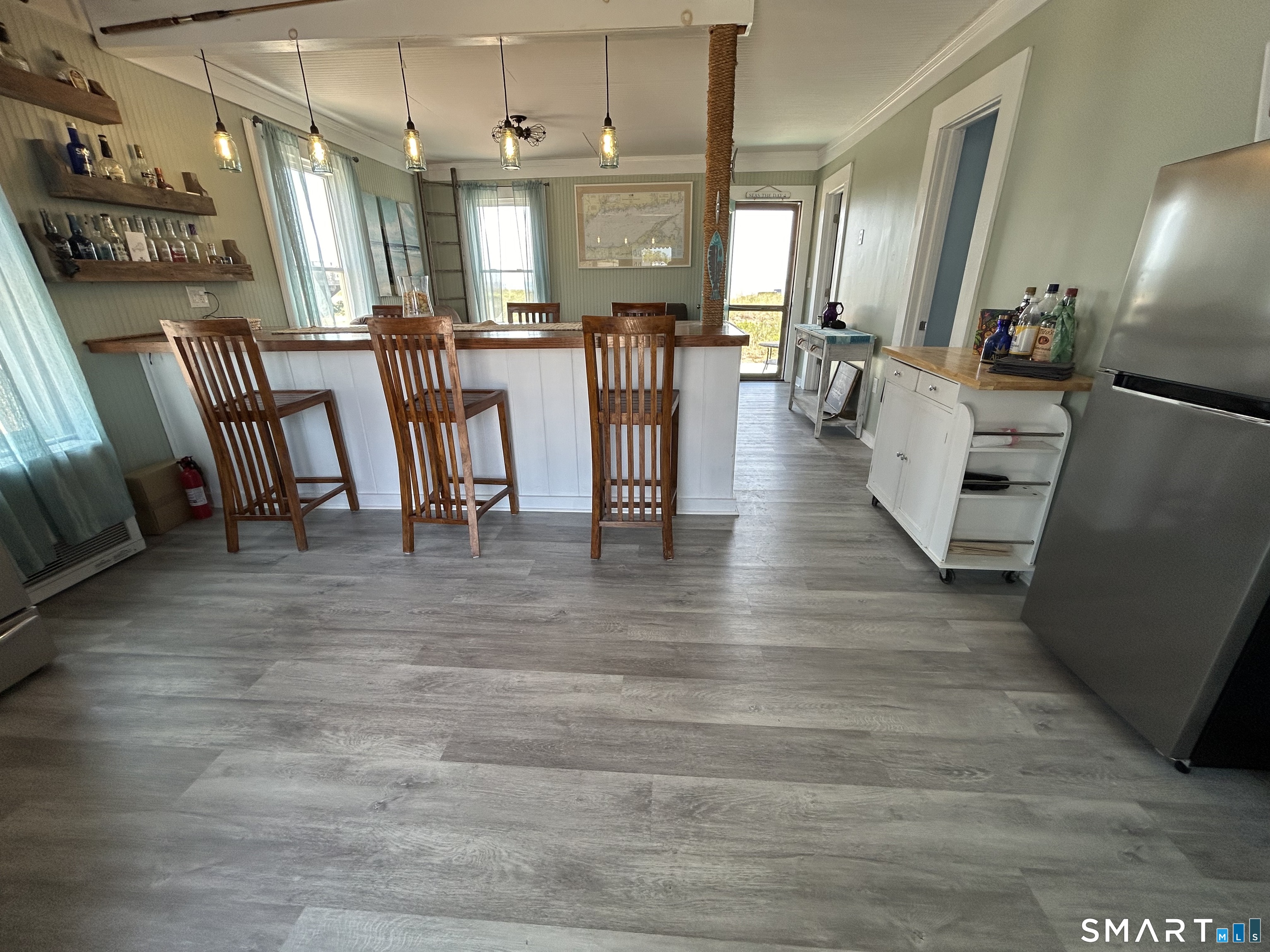 92 Caroline Road East Haven, CT 06512 - Photo 13 of 20 a view of a dining room with furniture window and wooden floor
