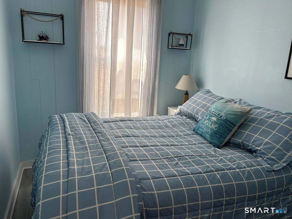 92 Caroline Road East Haven, CT 06512 - Photo 15 of 20 a bedroom with a bed and window