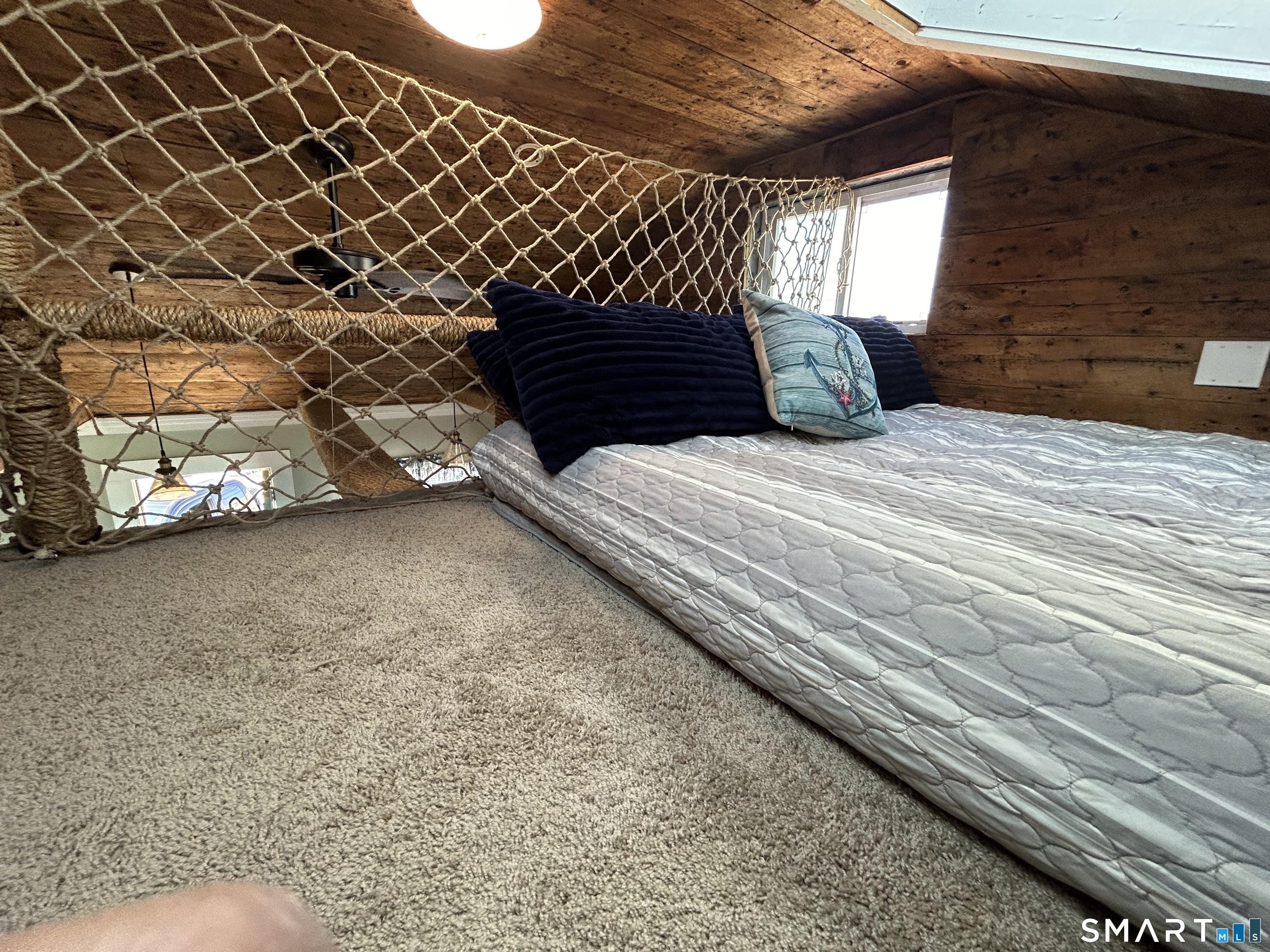 92 Caroline Road East Haven, CT 06512 - Photo 16 of 20 a bedroom with a bed and a window