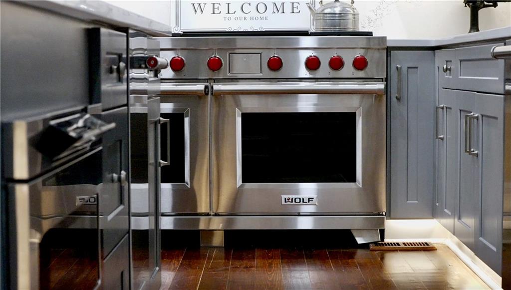 2425 Birmingham Road Alpharetta, GA 30004 - Photo 17 of 75 a living room with furniture and a fireplace