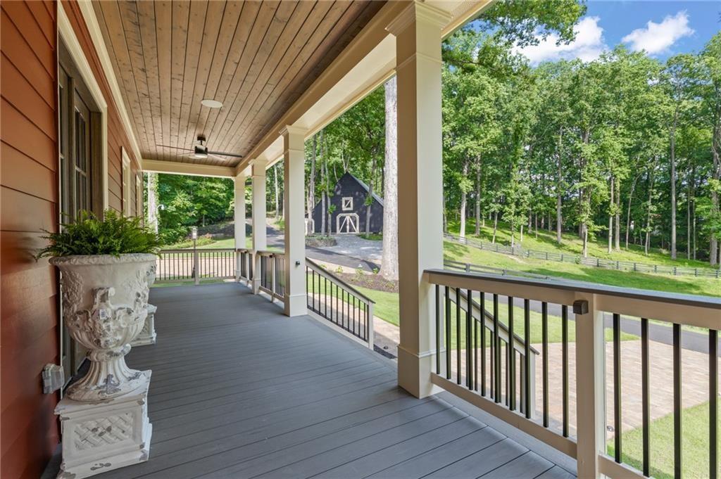 2425 Birmingham Road Alpharetta, GA 30004 - Photo 4 of 75 a view of a porch with wooden floor and outdoor space