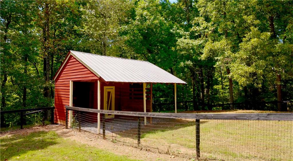 2425 Birmingham Road Alpharetta, GA 30004 - Photo 50 of 75 a view of a house with pool and chairs