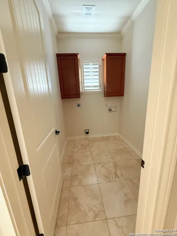 a view of a livingroom with wooden floor and staircase