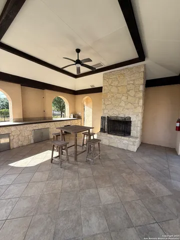 a view of a livingroom with furniture and a fireplace