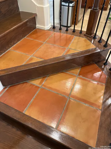 a room with table tennis and wooden floor