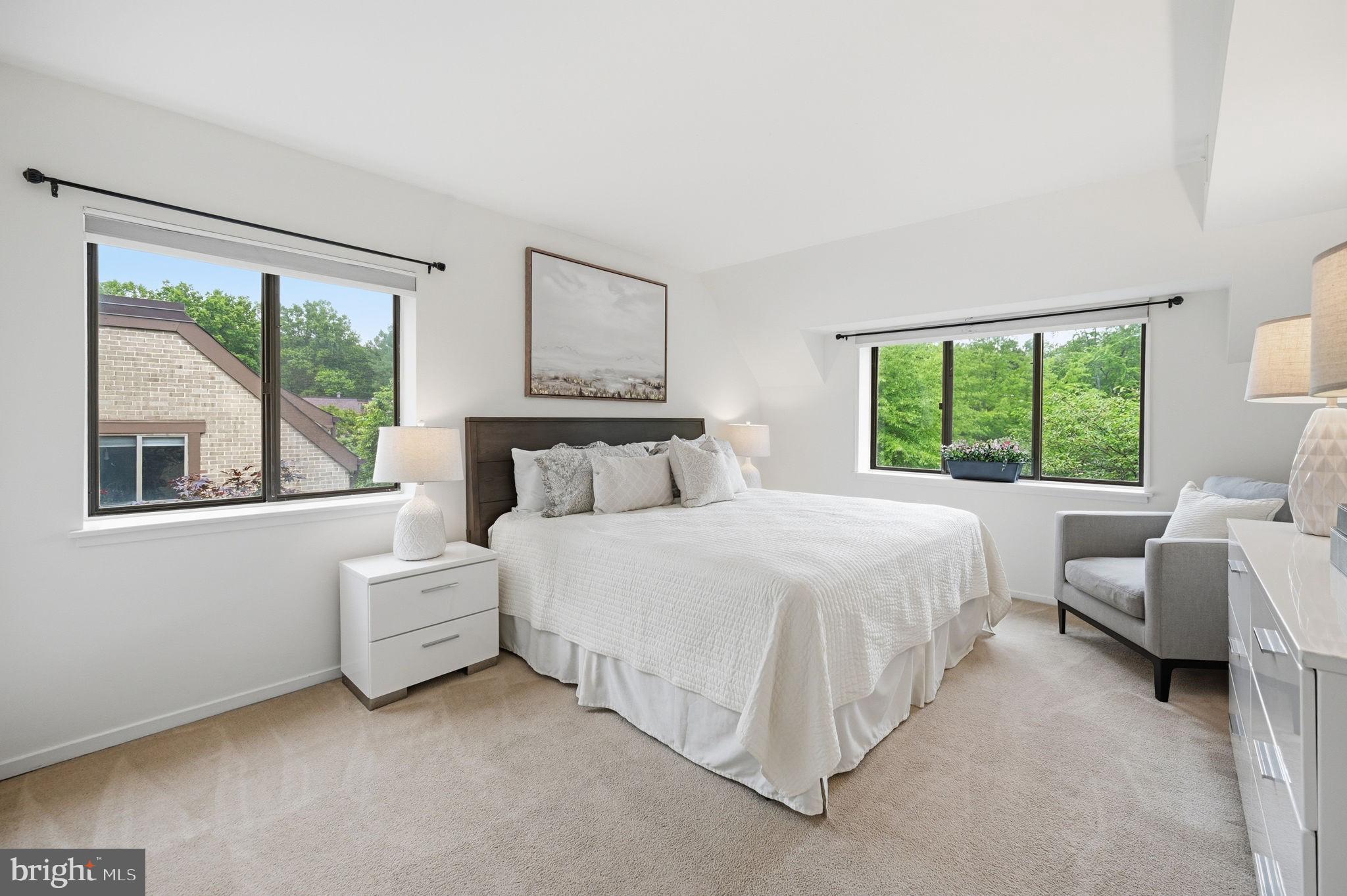 1659 Parkcrest Circle, Unit C Reston, VA 20190 - Photo 21 of 31 a bedroom with bed and a large window