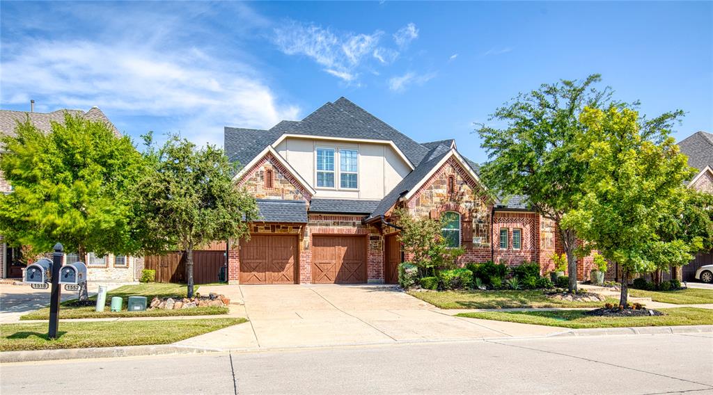 Welcome home to this beautiful home featuring a 3 car garage, unique courtyard entrance, and brick and stone exterior!
