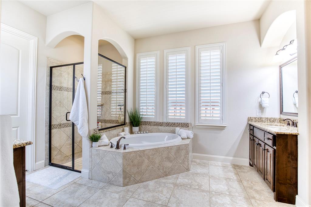 1552 Saddle Tree Road Frisco, TX 75036 - Photo 19 of 40 Large, Spa inspired primary bathroom with separate shower and tub and 2 large vanity and sinks