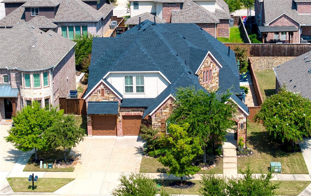 1552 Saddle Tree Road Frisco, TX 75036 - Photo 2 of 40 Aerial view of the welcoming front of the home. Notice the unique courtyard entrance to the right.