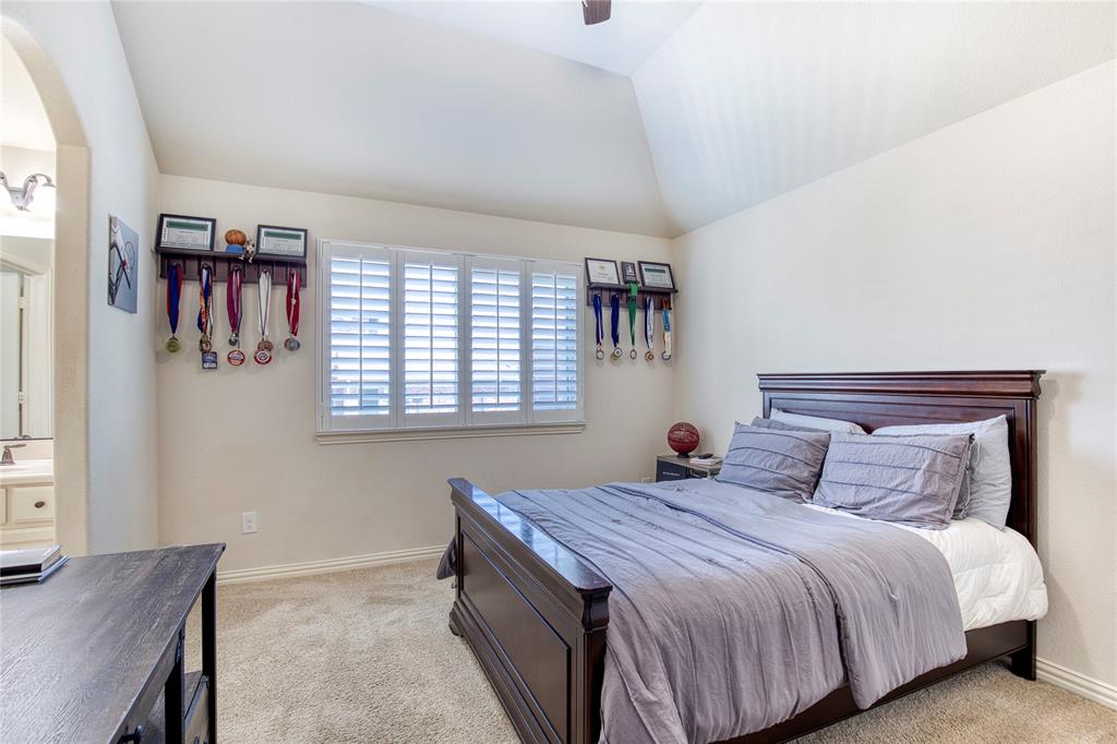 1552 Saddle Tree Road Frisco, TX 75036 - Photo 28 of 40 One of 3 bedrooms upstairs featuring lofted ceiling, light colored carpet, a ceiling fan, and arched walkways. Complete with sink in room that leads to Jack N Jill bath