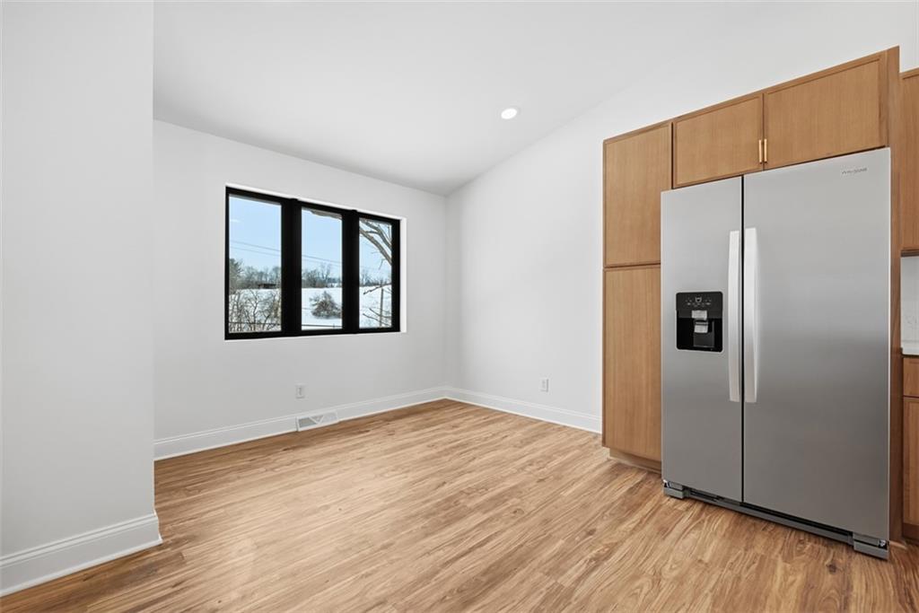 625 Manifold Road Washington, PA 15301 - Photo 11 of 46 a view of an empty room with wooden floor and a window