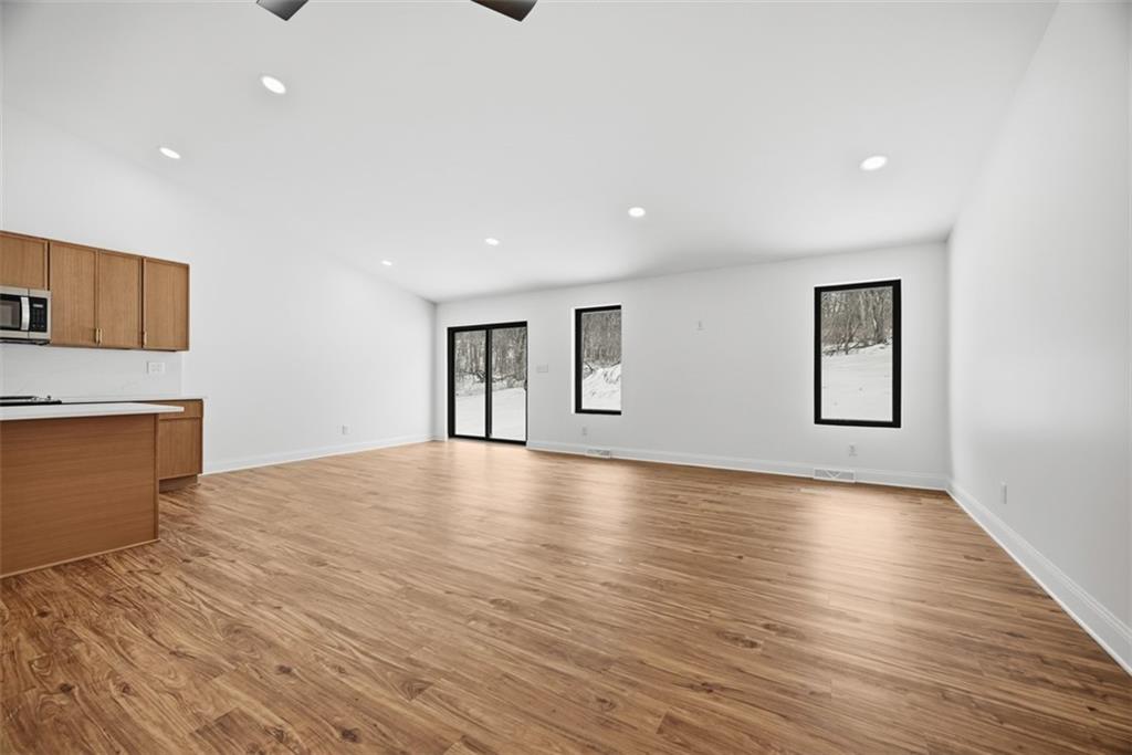 625 Manifold Road Washington, PA 15301 - Photo 13 of 46 a view of empty room with wooden floor and fireplace