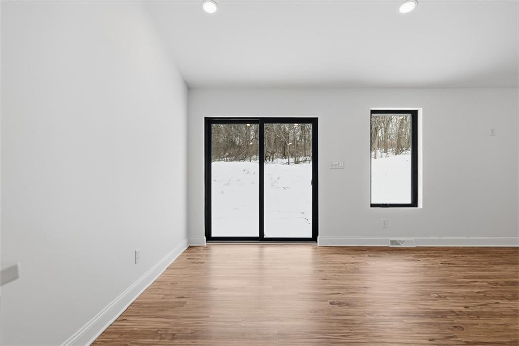 625 Manifold Road Washington, PA 15301 - Photo 15 of 46 an empty room with wooden floor and windows