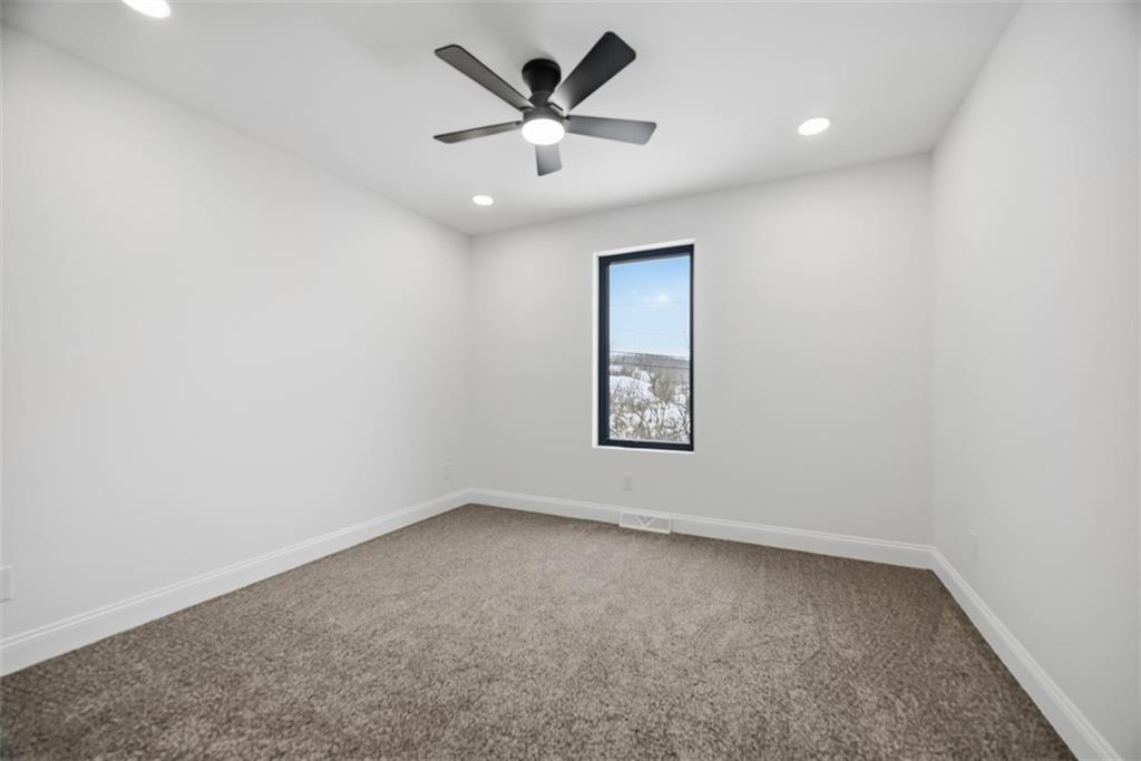 625 Manifold Road Washington, PA 15301 - Photo 18 of 46 an empty room with a ceiling fan and window