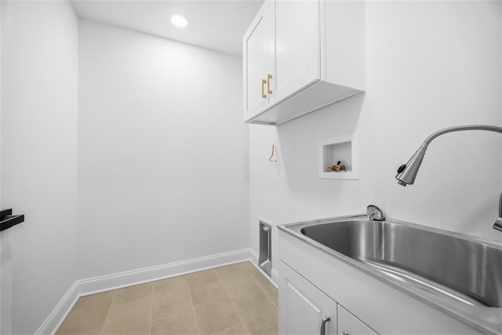 625 Manifold Road Washington, PA 15301 - Photo 20 of 46 a bathroom with a sink and washing machine