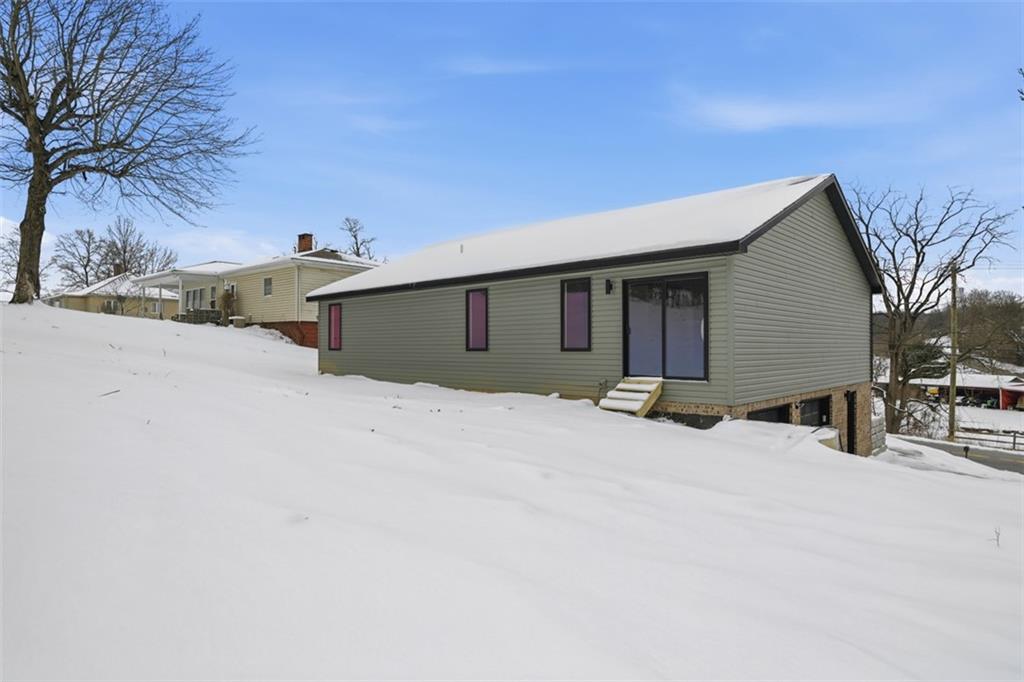 625 Manifold Road Washington, PA 15301 - Photo 40 of 46 a view of a house with a snow in the yard