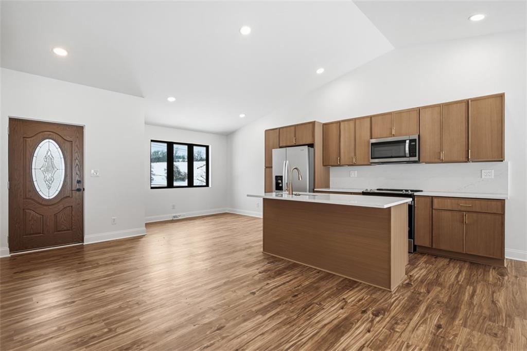 625 Manifold Road Washington, PA 15301 - Photo 6 of 46 a kitchen with wooden floors and wooden cabinets