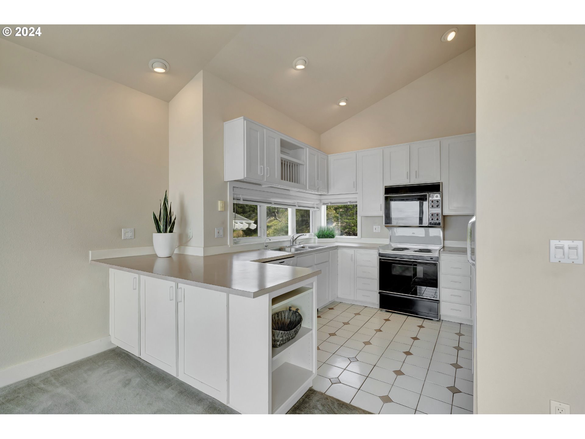 130 Capes Drive Oceanside, OR 97141 - Photo 17 of 48 a kitchen with cabinets and counter top space