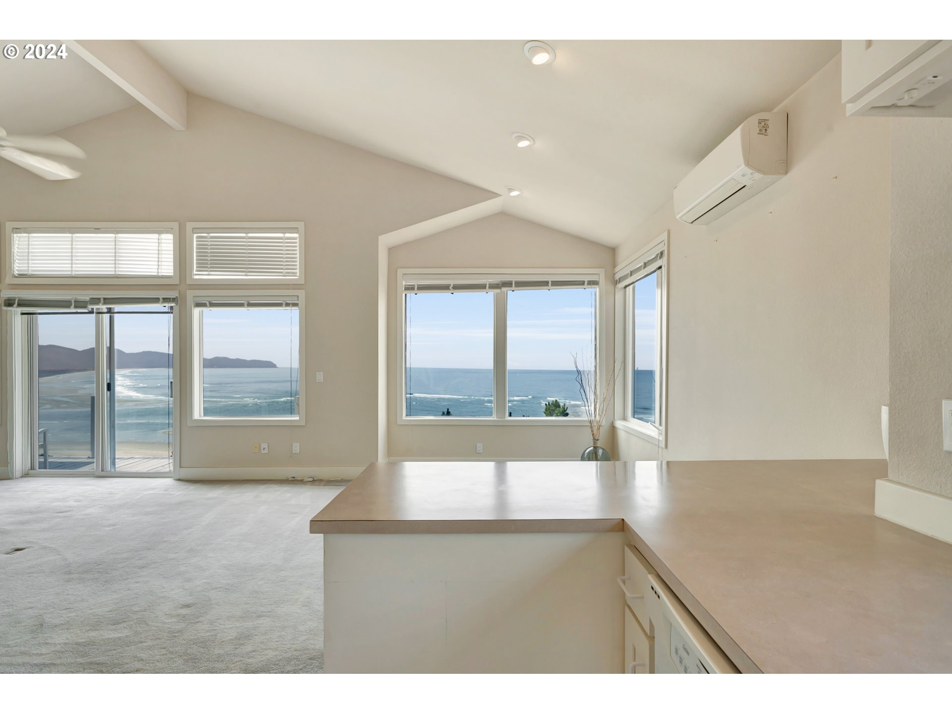 130 Capes Drive Oceanside, OR 97141 - Photo 20 of 48 a living room with a large window