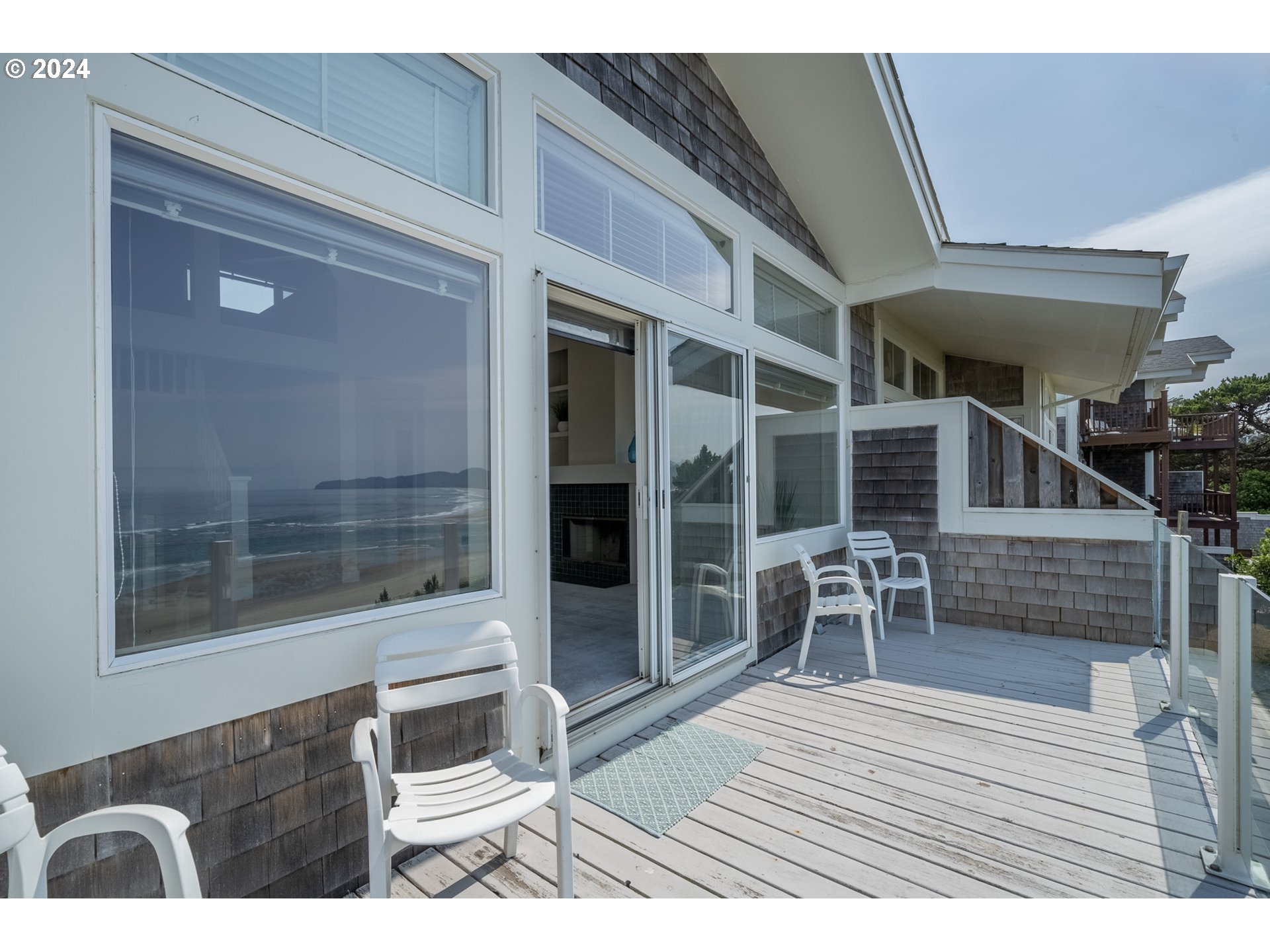 130 Capes Drive Oceanside, OR 97141 - Photo 21 of 48 a balcony with table and chairs