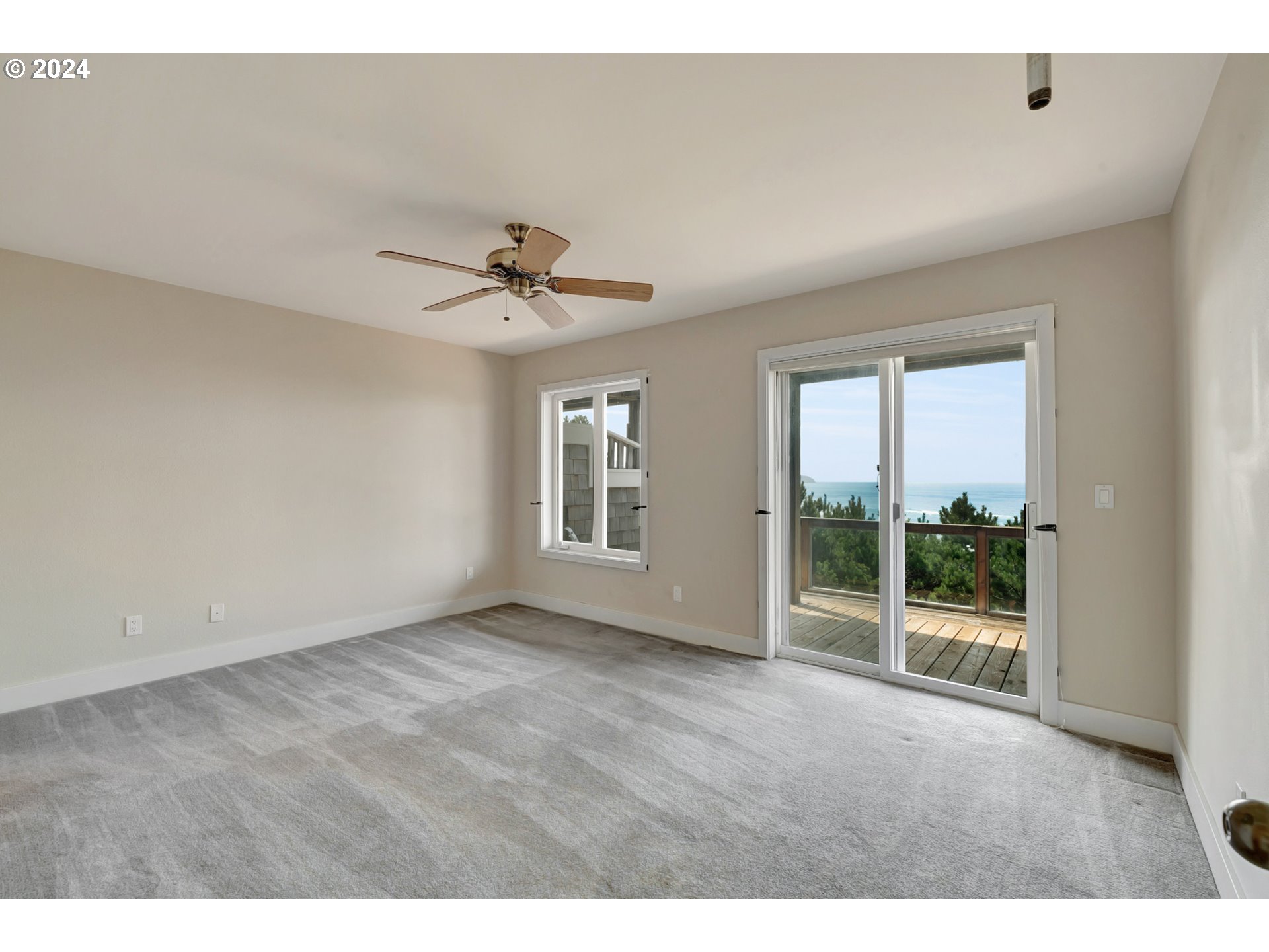 130 Capes Drive Oceanside, OR 97141 - Photo 30 of 48 a view of an empty room with a window