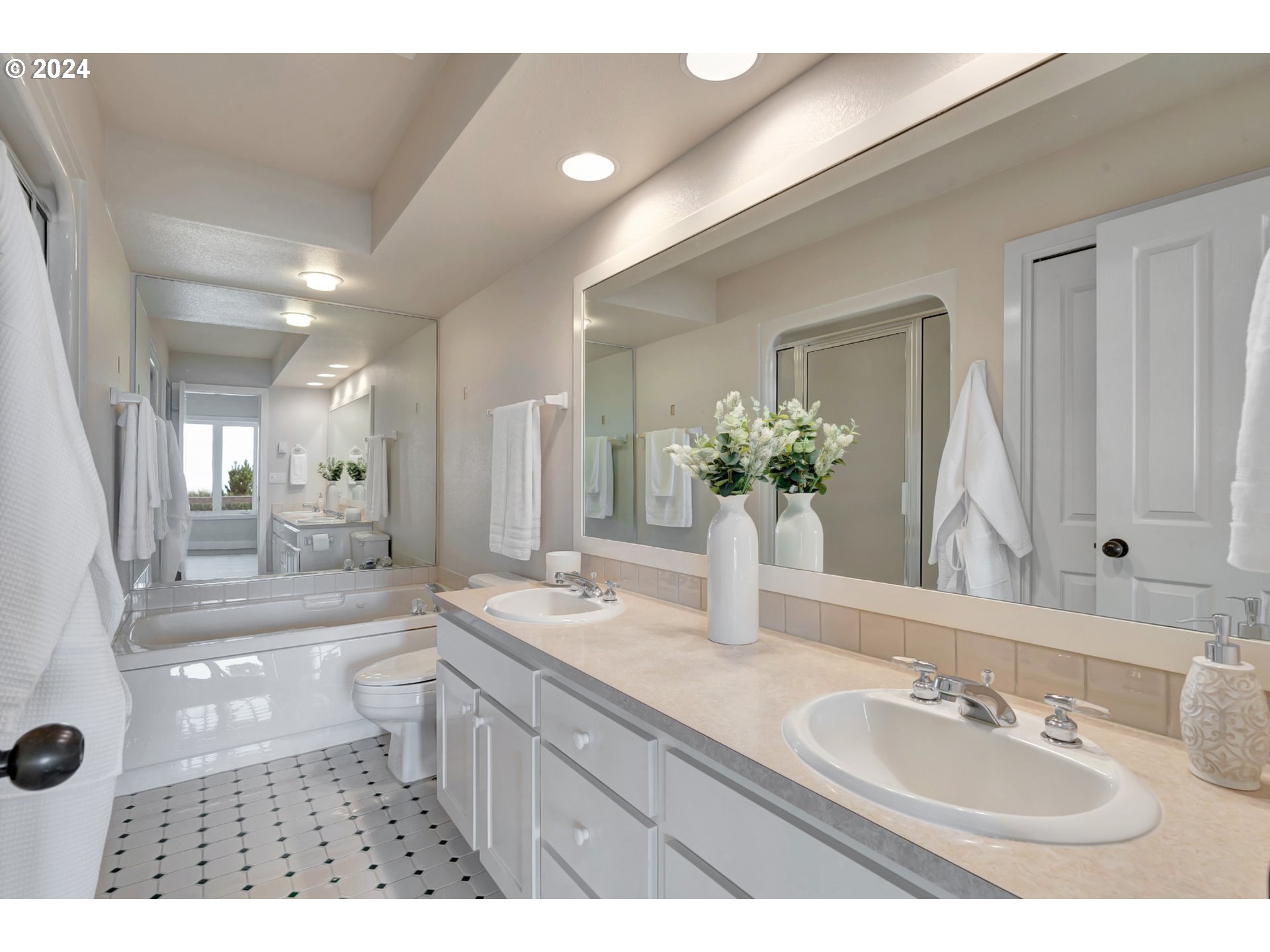 130 Capes Drive Oceanside, OR 97141 - Photo 32 of 48 a bathroom with a granite countertop sink mirror and a