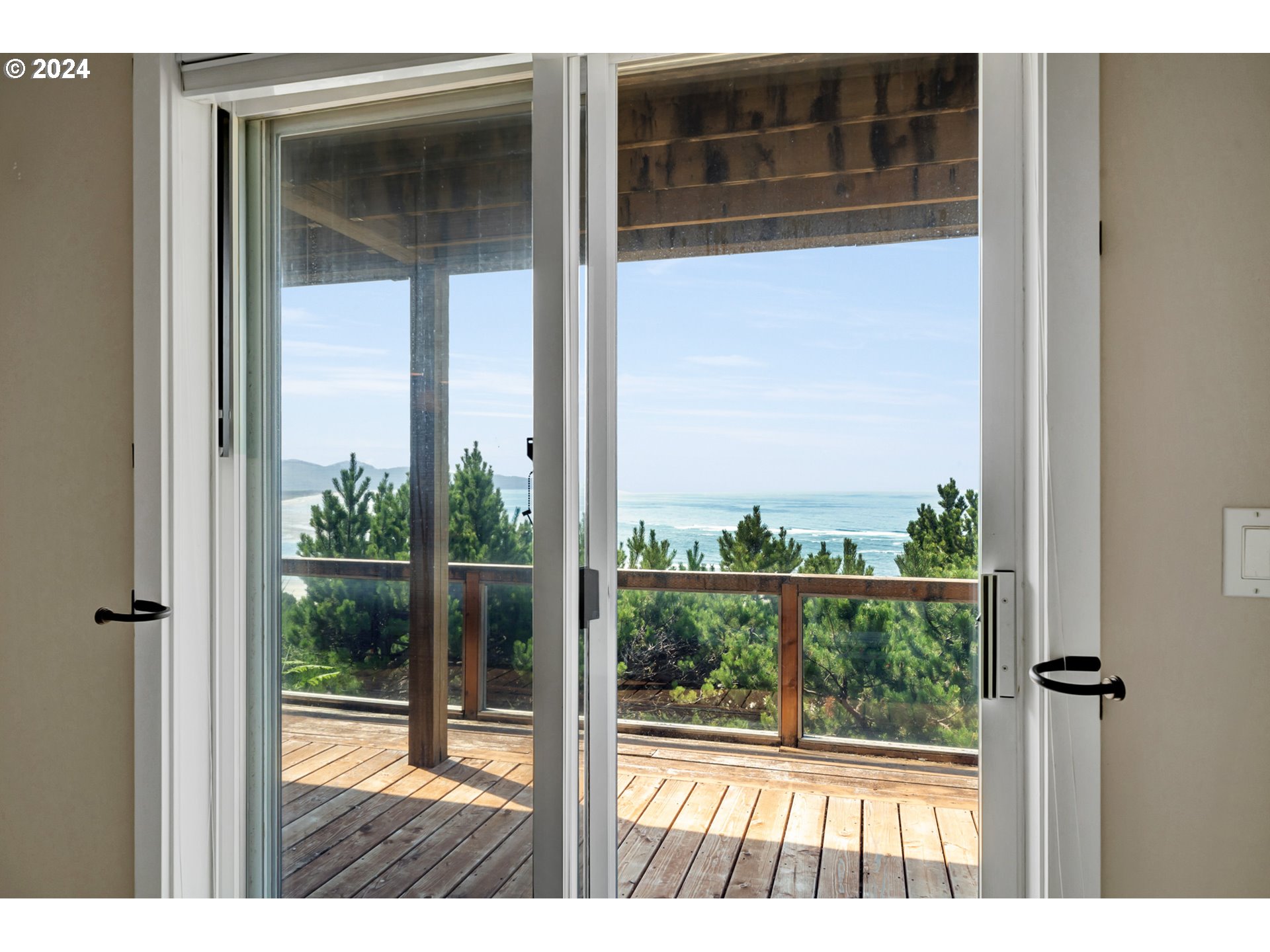 130 Capes Drive Oceanside, OR 97141 - Photo 34 of 48 a view of a window with a small yard