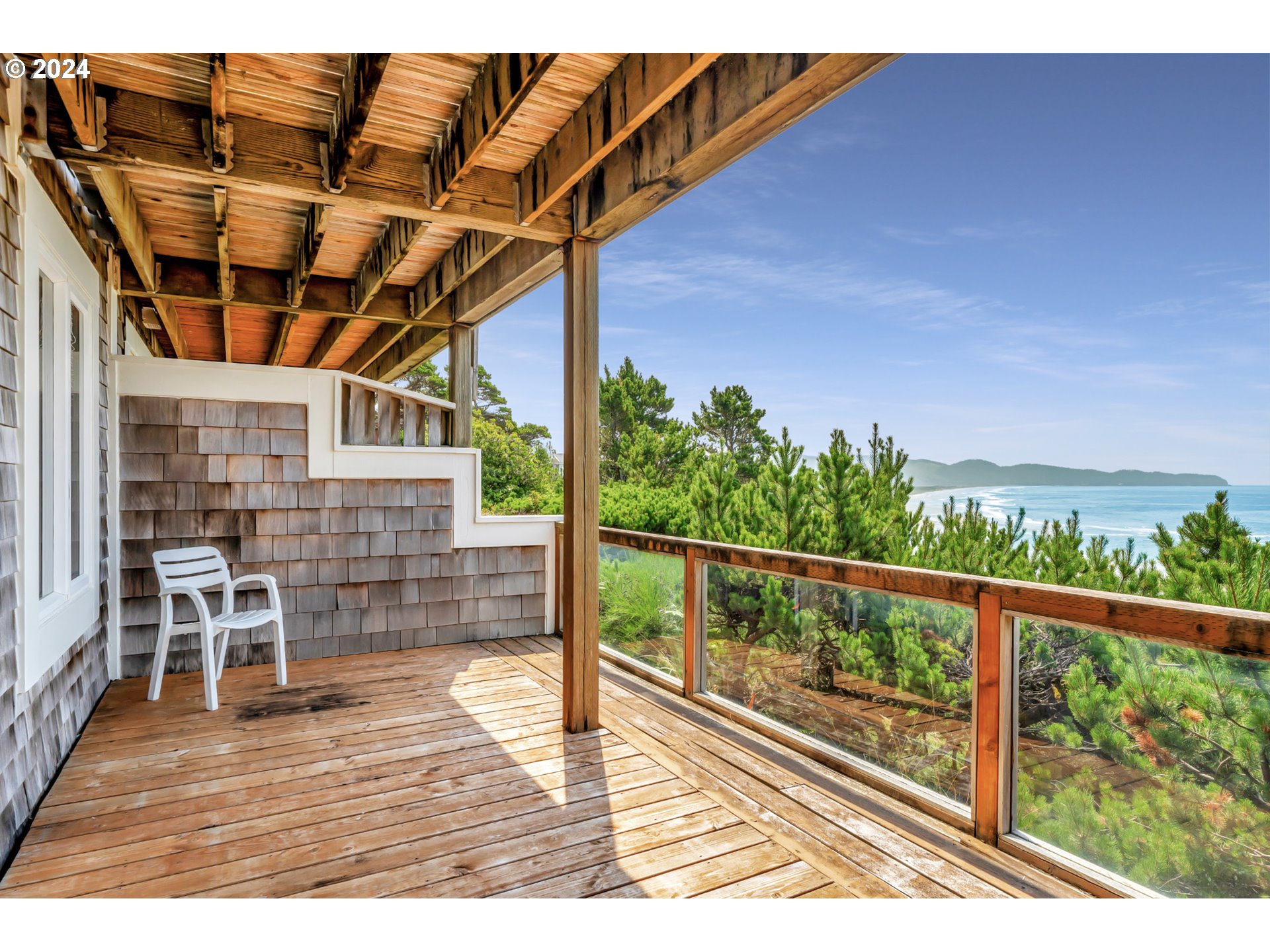 130 Capes Drive Oceanside, OR 97141 - Photo 35 of 48 a view of balcony with wooden floor and seating space